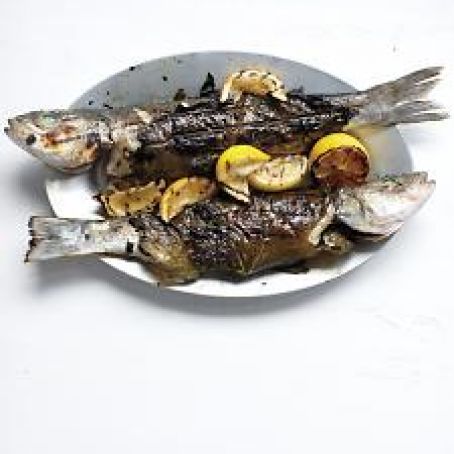 Whole Branzino in Grape Leaves with Zucchini, Olives, and Mint