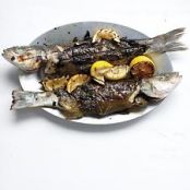 Whole Branzino in Grape Leaves with Zucchini, Olives, and Mint