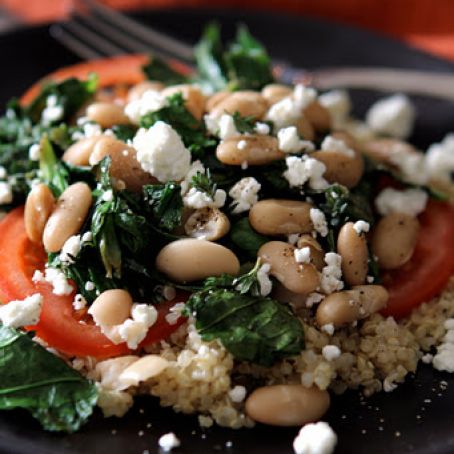 Leafy Greens & Cannellini Beans with Fresh Tomato and Goat Cheese served over warm Quinoa