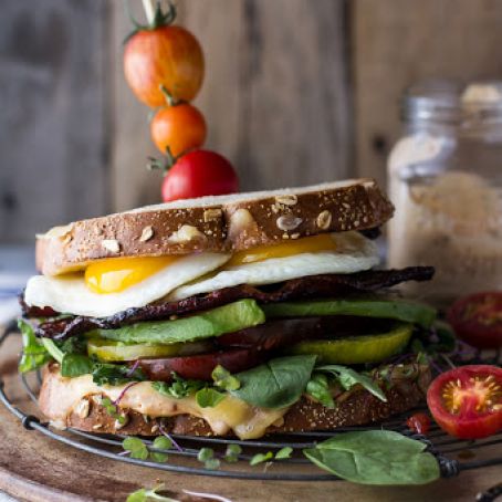 Bourbon Caramelized Bacon and Heirloom Tomato BLT w/Fried Eggs + Smoked Gouda.