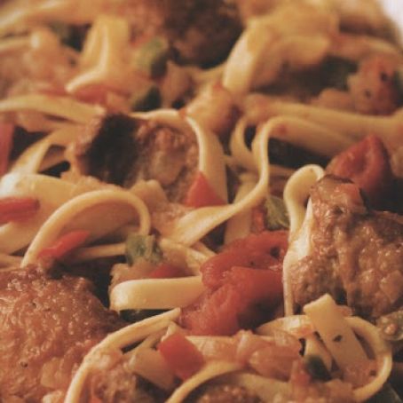 PASTA WITH BRAISED CHICKEN, SAUSAGES, PEPPERS & TOMATOES