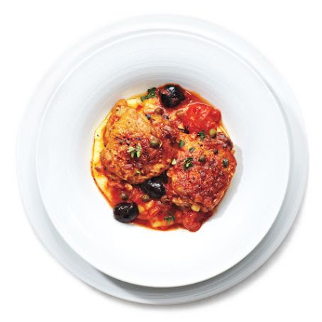 Tomato-Braised Chicken Thighs With Olives and Capers Over Polenta