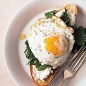 Kale, Lemon, & Ricotta Bruschetta topped with a Fried Egg