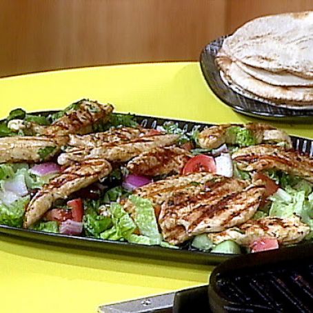 Greek Grilled Chicken and Vegetable Salad with Warm Pita Bread for Wrapping