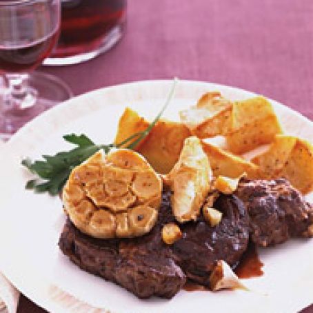 Bison Rib Eye Steaks with Roasted Garlic