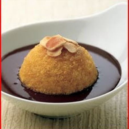 bread pudding cakes with toasted almonds and chocolate sauce