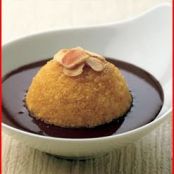 bread pudding cakes with toasted almonds and chocolate sauce