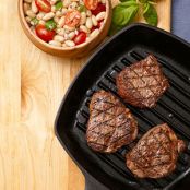 Grilled Beef with Basil Puree Over Tuscan Beans