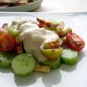 Cheese salad with hummus dressing and pitta crisps