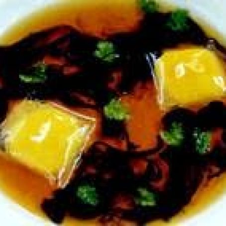 Black Truffle Stracciatella with Quails' Egg-Yolk Ravioli