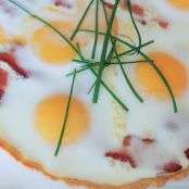 BREAKFAST PIZZA WITH GRUYERE, BAKED EGGS, AND BACON