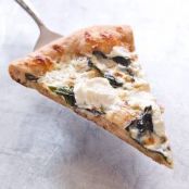 Thin-Crust Whole-Wheat Pizza with Garlic Oil, Three Cheeses, and Basil