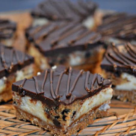 COOKIE DOUGH CHEESECAKE BARS TOPPED WITH A CHOCOLATE GLAZE!