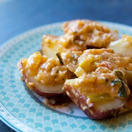 POTATOES WITH CHEESE AND TOMATOES