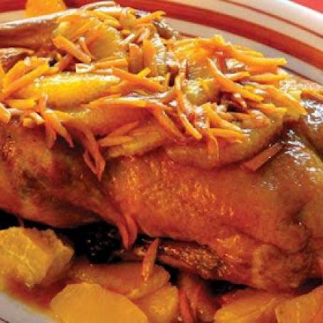 Pato asado con naranjas