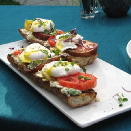 Poached Eggs on Toasted Baguette with Goat Cheese, and Black Pepper Vinaigrette