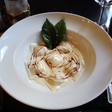 Pumpkin Ravioli in Parmesan Fondue with Red Wine Reduction