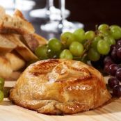 Baked Brie with Raspberry Jam, Almonds, & Cranberries