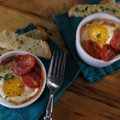 Shirred Eggs with Prosciutto, Candied Tomatoes, Parmesan-Rosemary Cream and Ciabatta Sticks