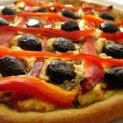 PIZZA CON PESTO Y QUESO DE CABRA