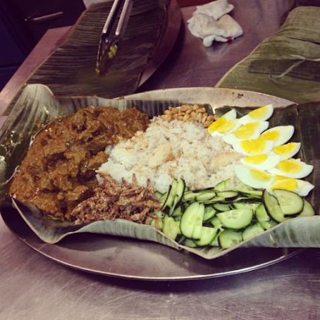Nasi Lemak - Ginger Infused Steamed Rice with Wedges of Hard Boiled Eggs, Cucumber Slices, Crispy Anchovies and Peanuts