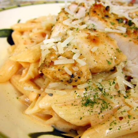 Grilled Chicken over Tomato Alfredo Sauce