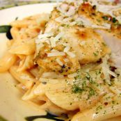 Grilled Chicken over Tomato Alfredo Sauce