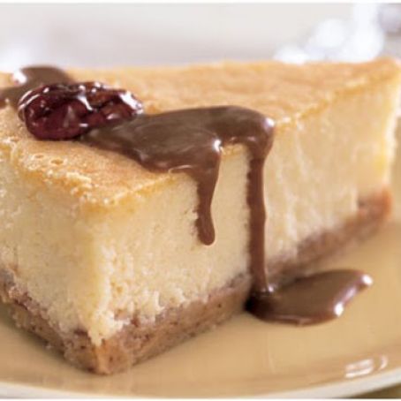 Mascarpone Cheesecake with Candied Pecans and Dulce de Leche Sauce